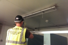 staff installing new light fitting and extractor fan PIR